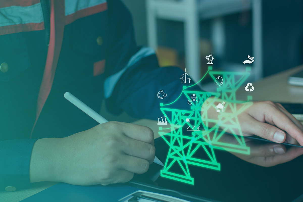 “A technician reviewing digital energy network visuals on a tablet as part of Metering, Infrastructure and Data Services.”