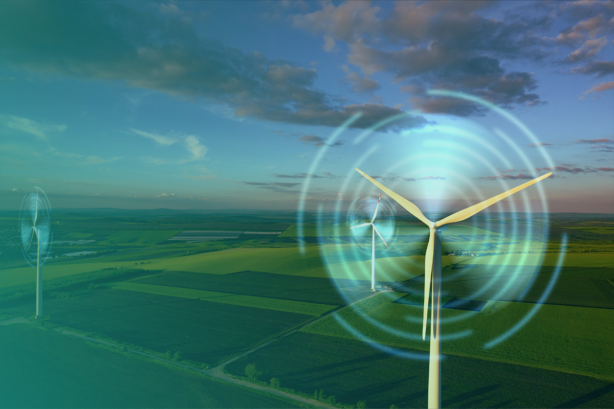 “Aerial view of wind turbines with digital energy rings symbolising how Renewable Energy Contracts support clean power generation.”