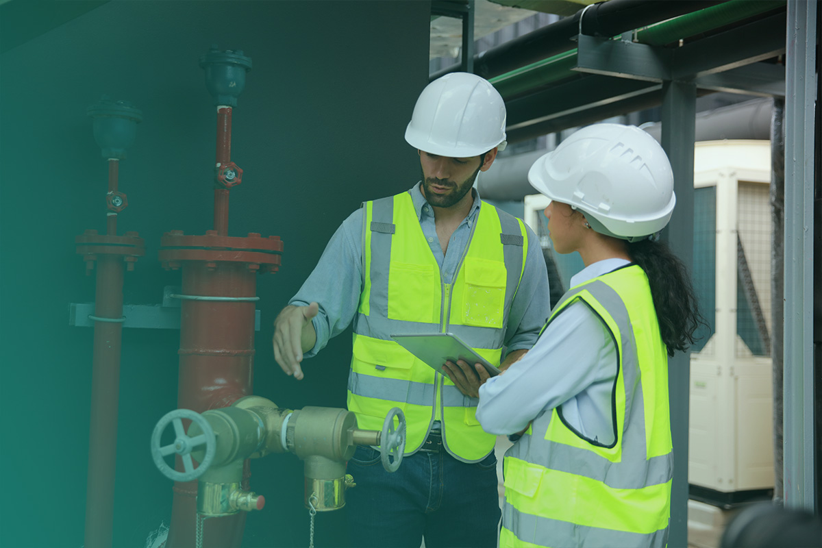 “Engineers inspecting industrial water infrastructure as part of Water Audits and Recovery processes.”