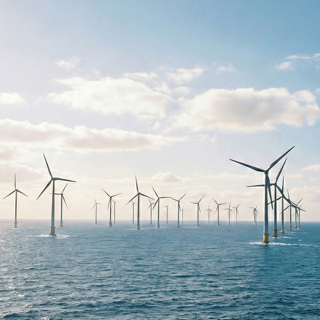Offshore wind farm at sea representing commercial renewable energy contracts and large scale clean power generation.