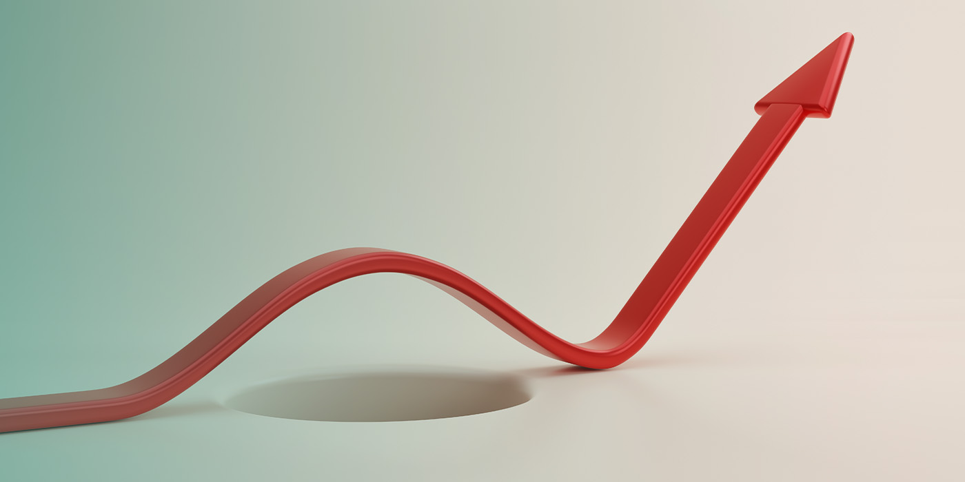 Curved red arrow avoiding a pitfall, symbolising the resilience of a well-planned energy procurement