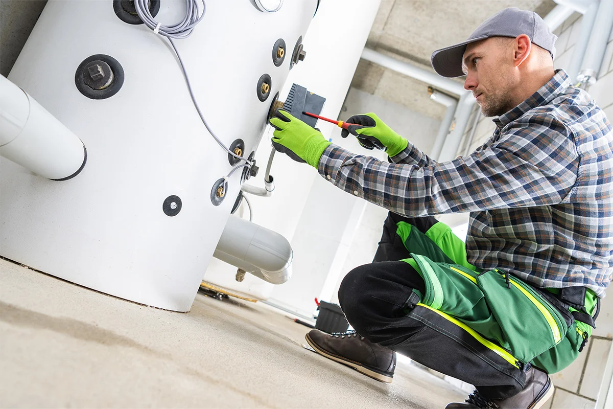 Engineer inspecting energy infrastructure and equipment as part of a siteworks discovery call to assess project readiness and connection requirements.