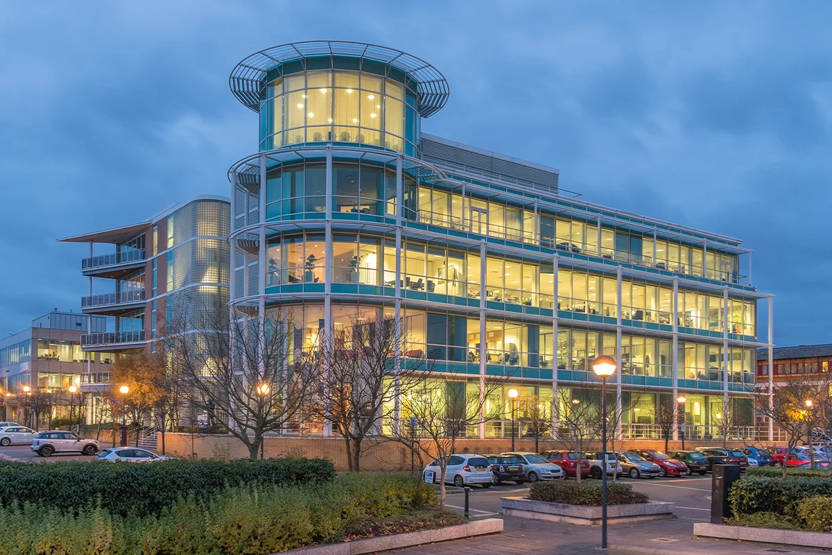 Modern commercial office building at dusk representing the type of property that benefits from a siteworks discovery call for energy and utility coordination.