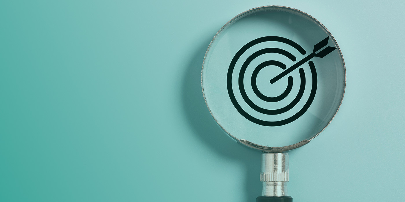 “Magnifying glass revealing a target symbol, representing the need to identify and avoid common Energy Procurement Mistakes.”