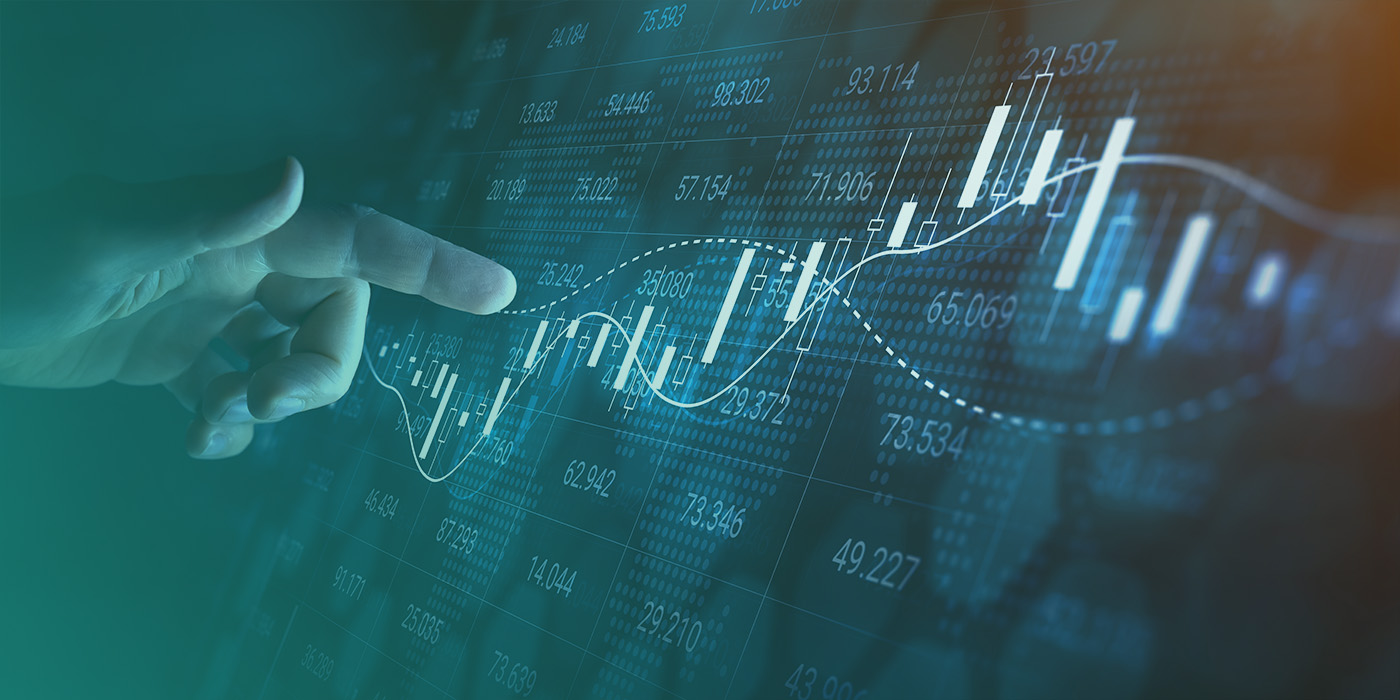 Close-up of a hand analysing fluctuating energy market graphs, illustrating data-driven decisions for an Energy Procurement Strategy 2026.