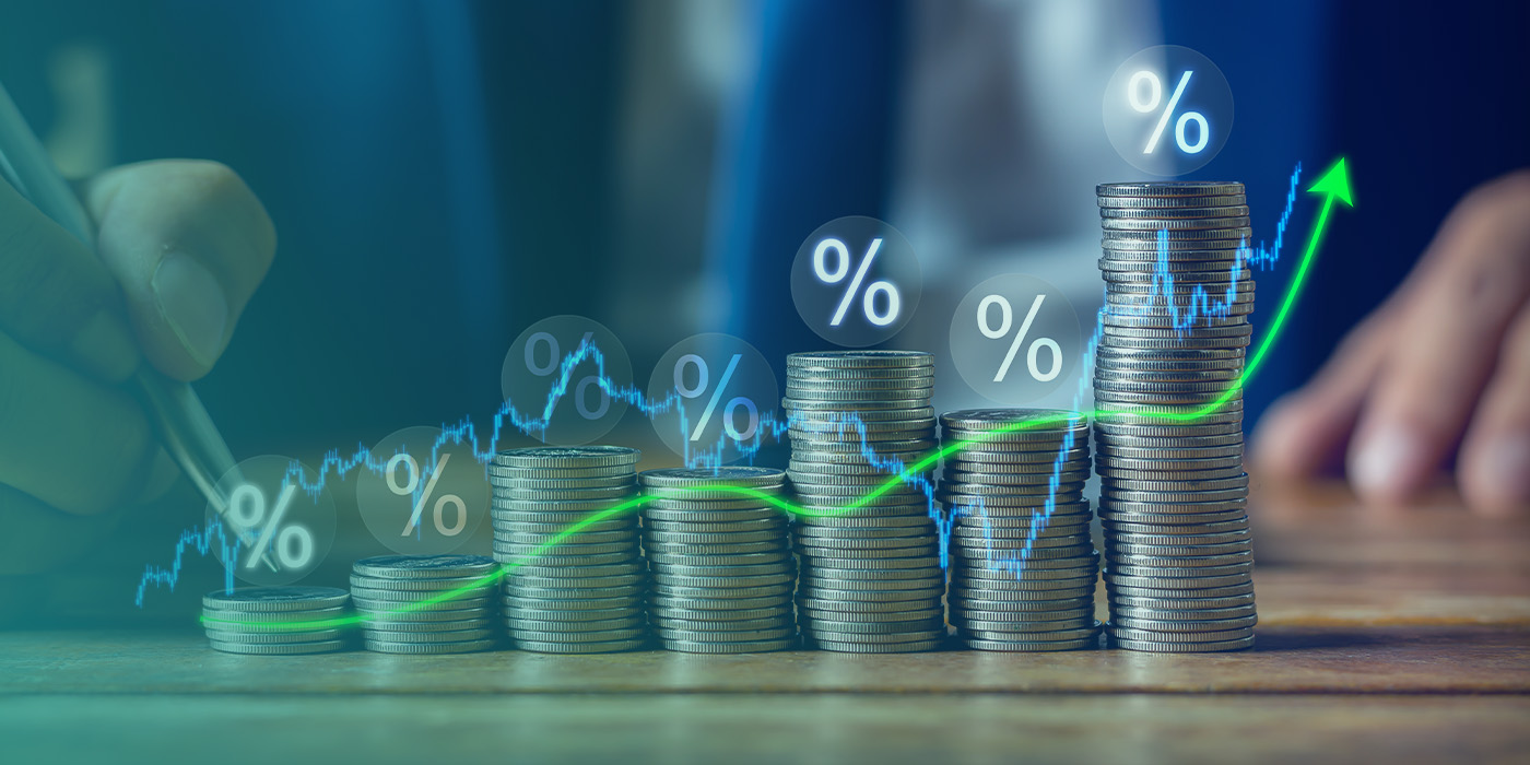 Stacked coins and upward financial graph illustrating cost savings unlocked through BMS Recommissioning.