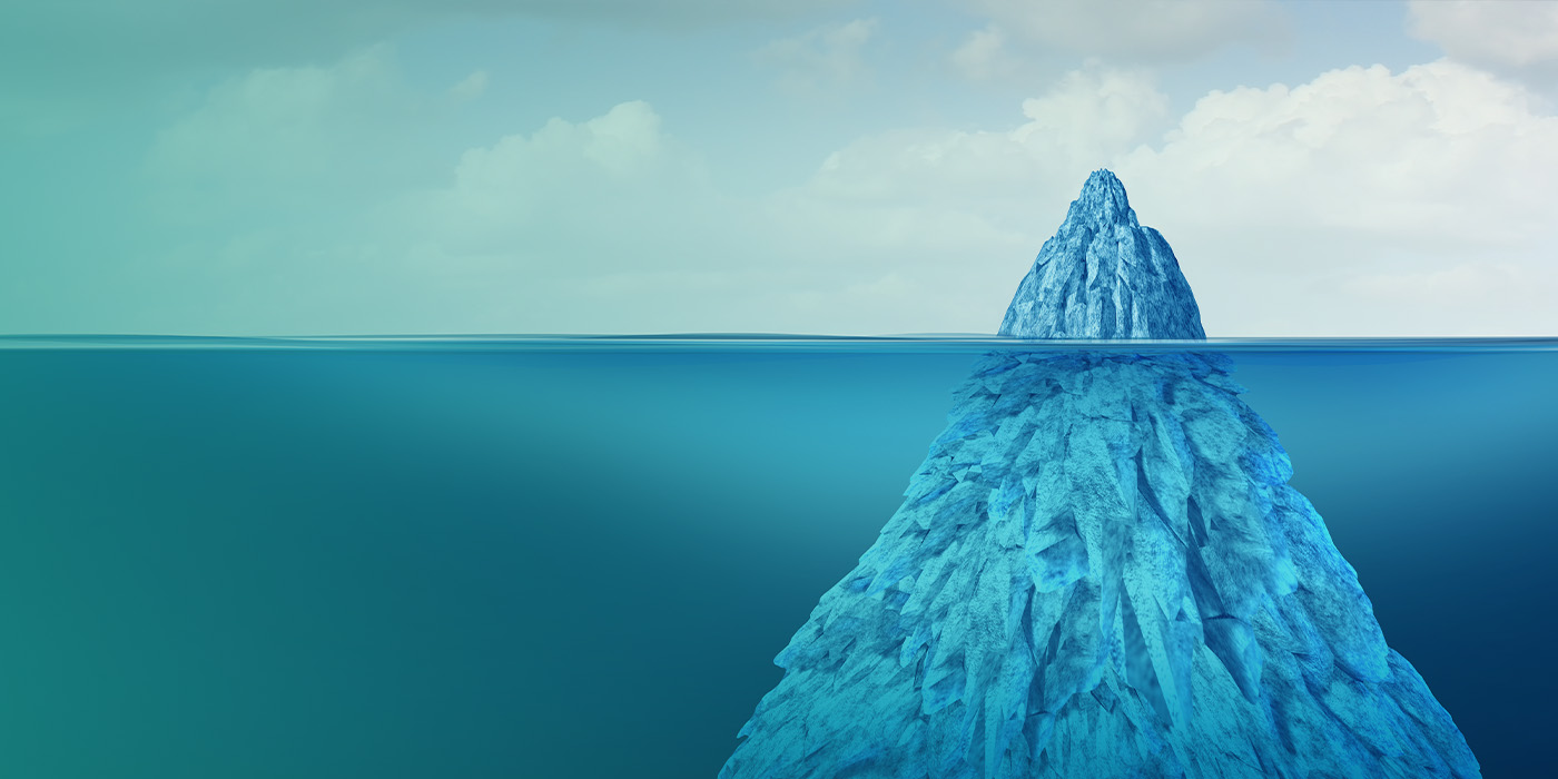 Iceberg metaphor illustrating hidden cost risks beneath the surface of Fixed Energy Tariffs Multi Site Portfolios.